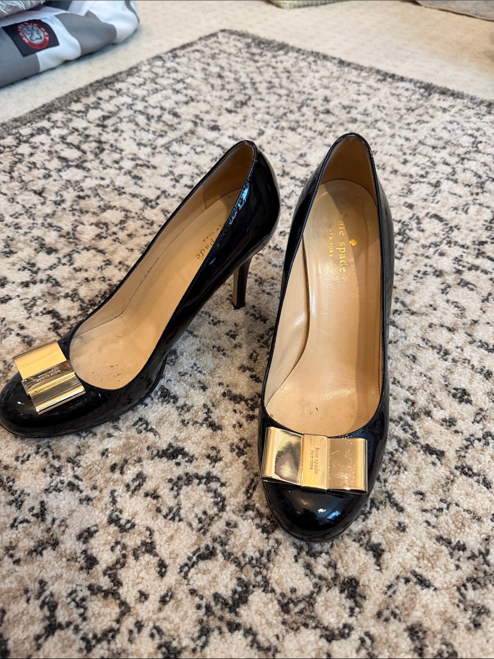 kate spade Black Patent Leather Pumps with Gold Bow